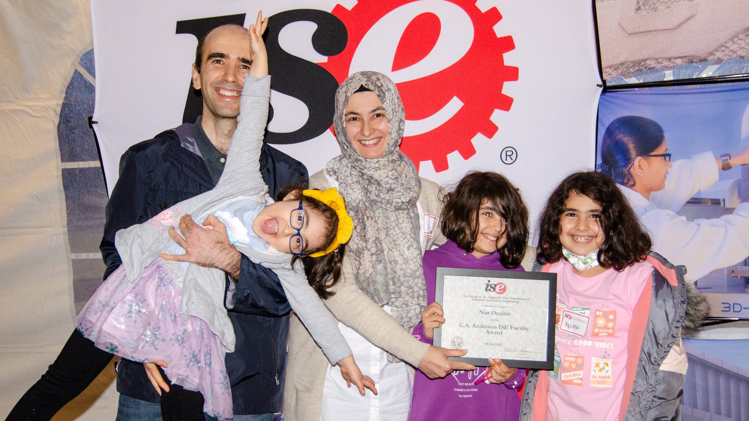 Nur Ozaltin celebrating her award with her family at the 2022 C.A. Anderson Awards