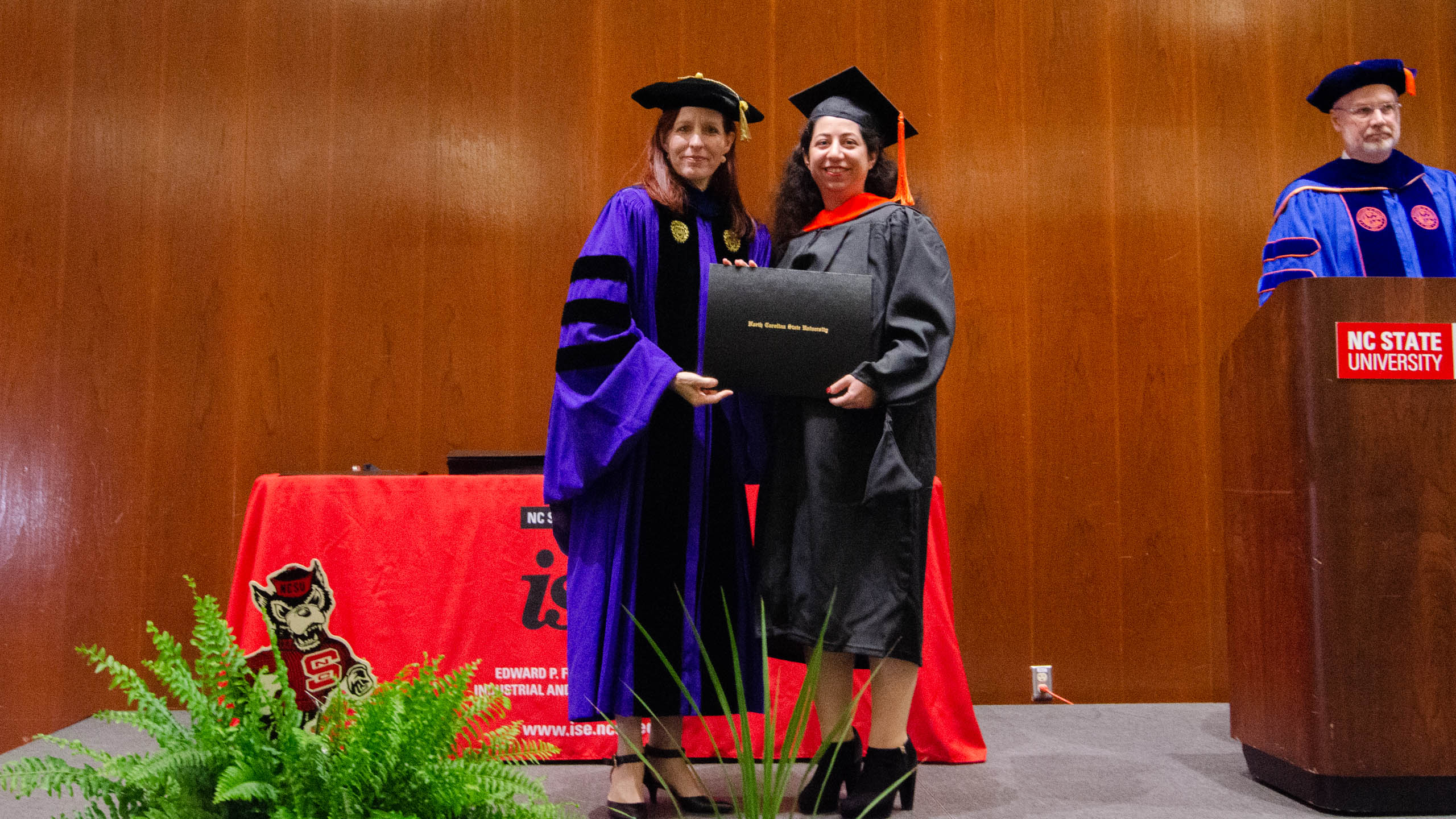 Delshad Zaker receiving her diploma receiving her diploma at the Spring 2022 Graduation