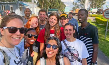 Kanton Reynolds and his group of student posing for a selfie at the Rwandan border