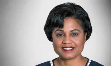 A headshot of Gayle Lanier standing in front of a white background.