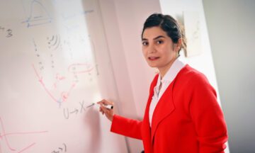 ISE assistant professor Sara Shashaani writing on a whiteboard