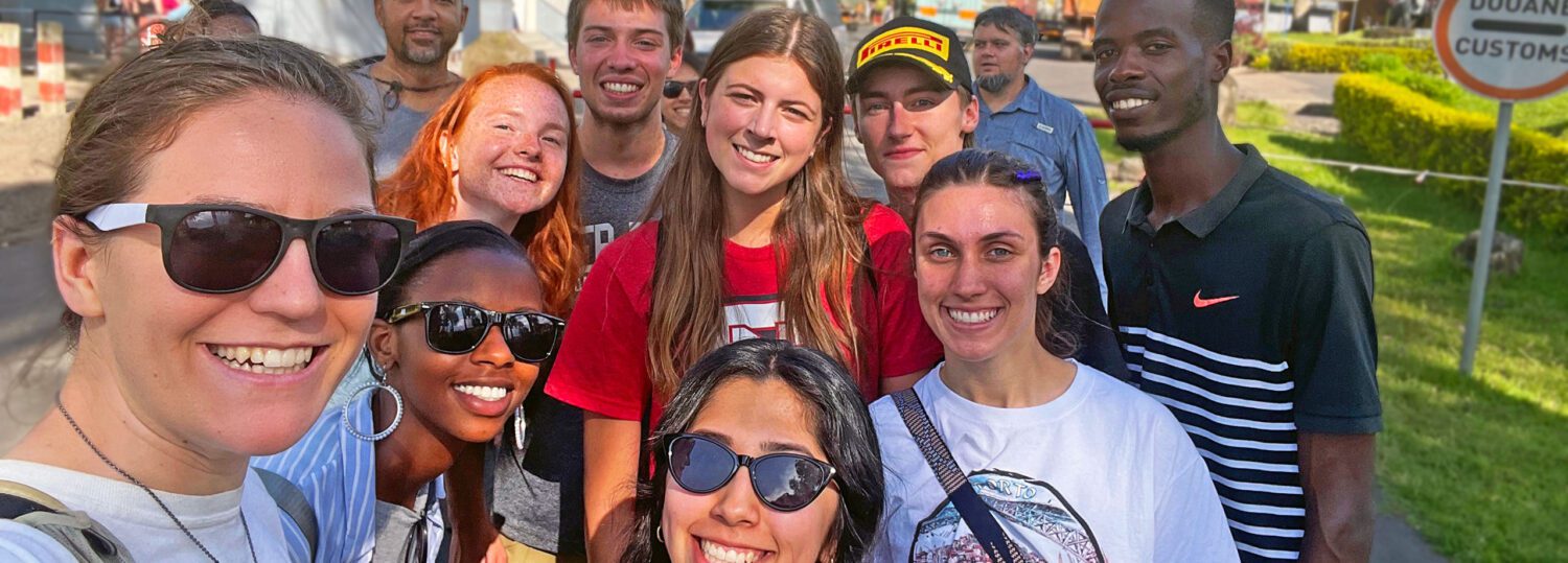 Kanton Reynolds and his group of student posing for a selfie at the Rwandan border