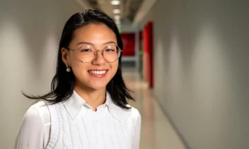 A headshot of Molly Li standing in a hallway in fitts-Woolard Hall.