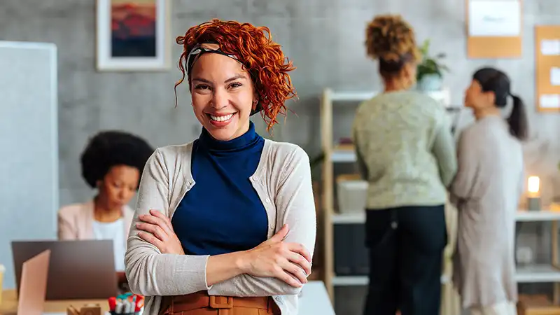 A student working with her team on their entrepreneurship project as part of the Master of Engineering Management degree at NC State University.