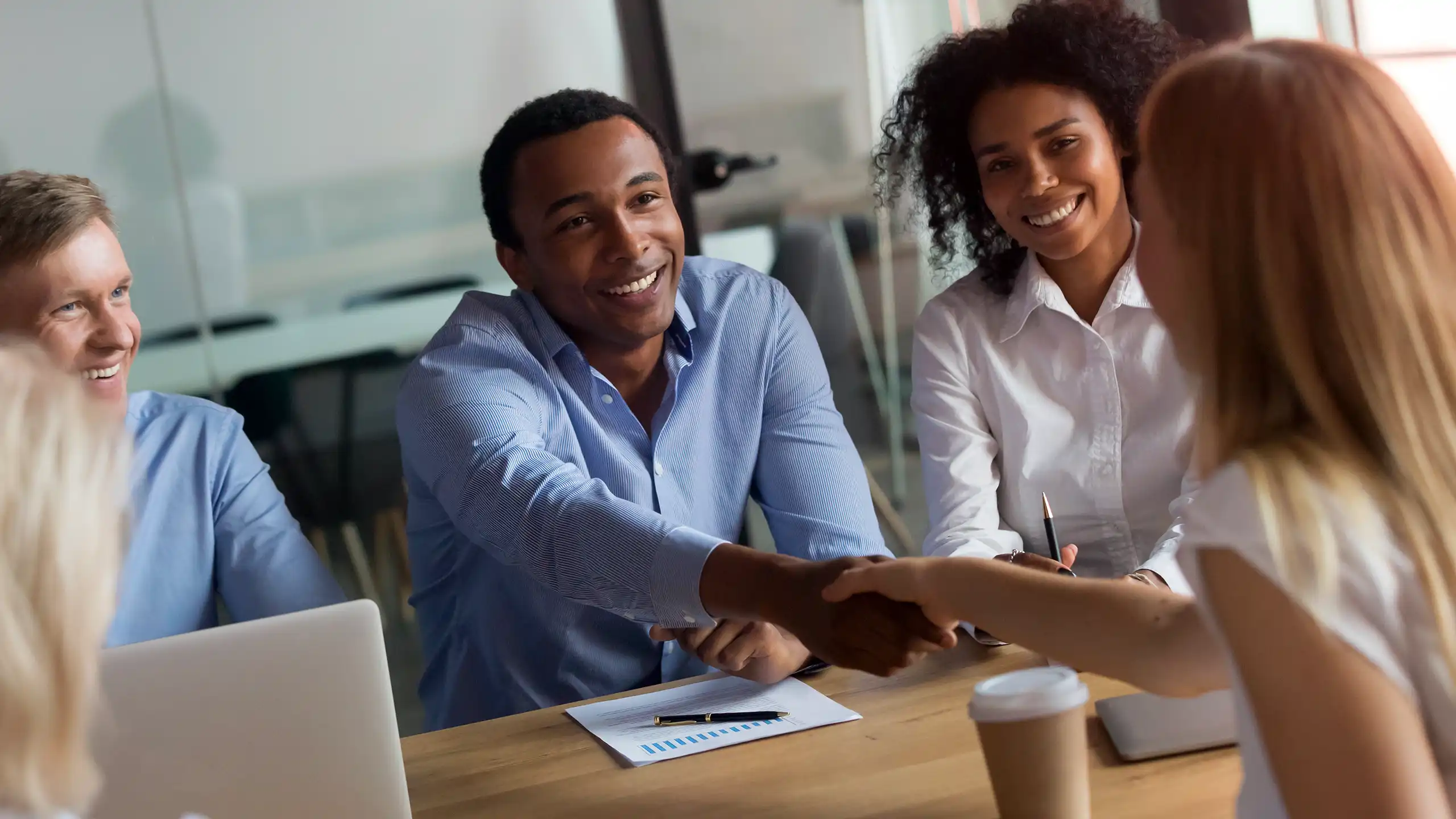 A handshake between an NC State MEM student on the job market and her new employers.