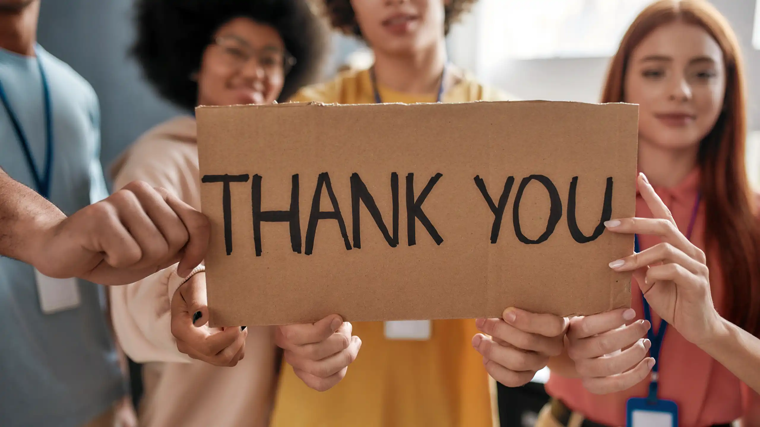 A group of MEM students holding up a sign that reads, "Thank You"