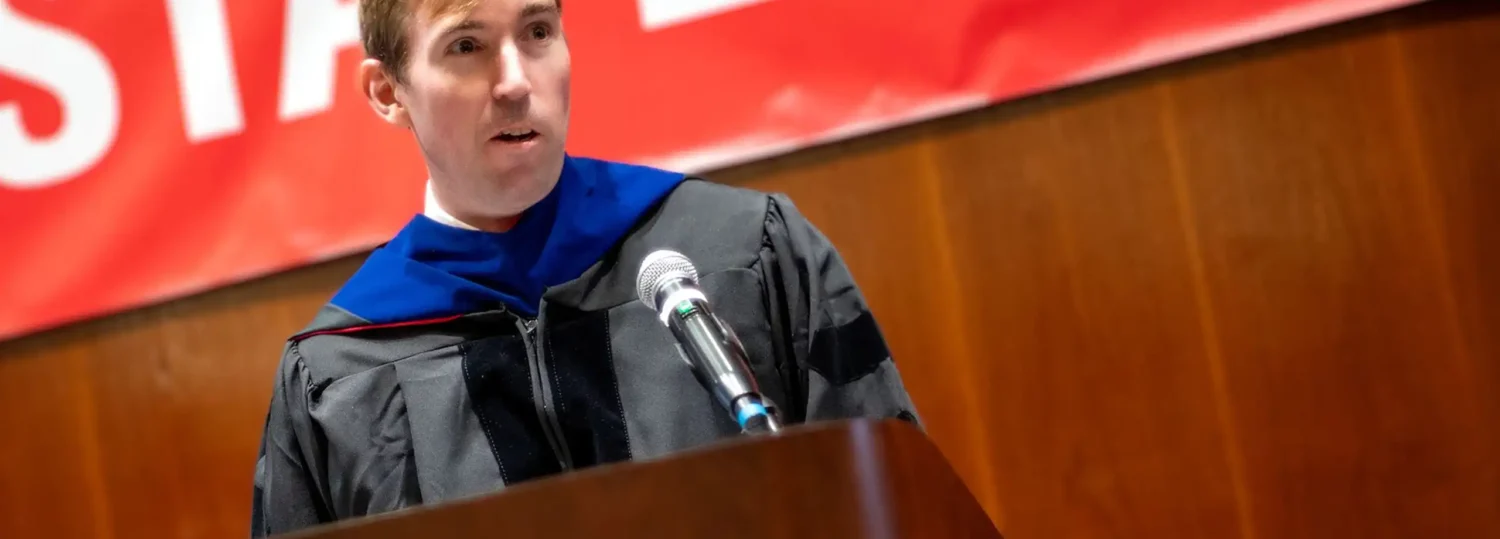 Director Brandon McConnell addressing all of the MEM graduates.