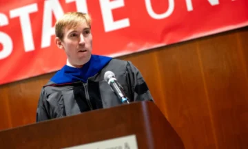 Director Brandon McConnell addressing all of the MEM graduates.