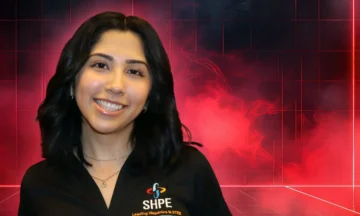 A headshot of Daniela Santibanez standing in front of a red and black abstract background.