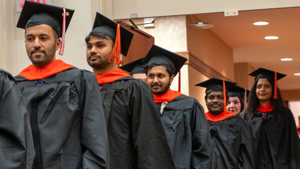 Students walking into the commencement ceremony.