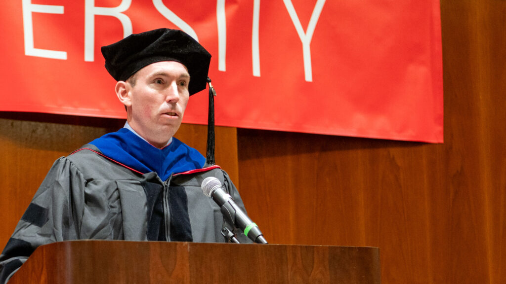 Dr. McConnell addressing the audience at graduation.