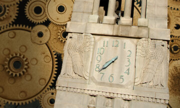 NC State Belltower on a backdrop of golden gears.