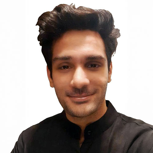 A headshot of Sameep Chandaliya standing in front of a white background