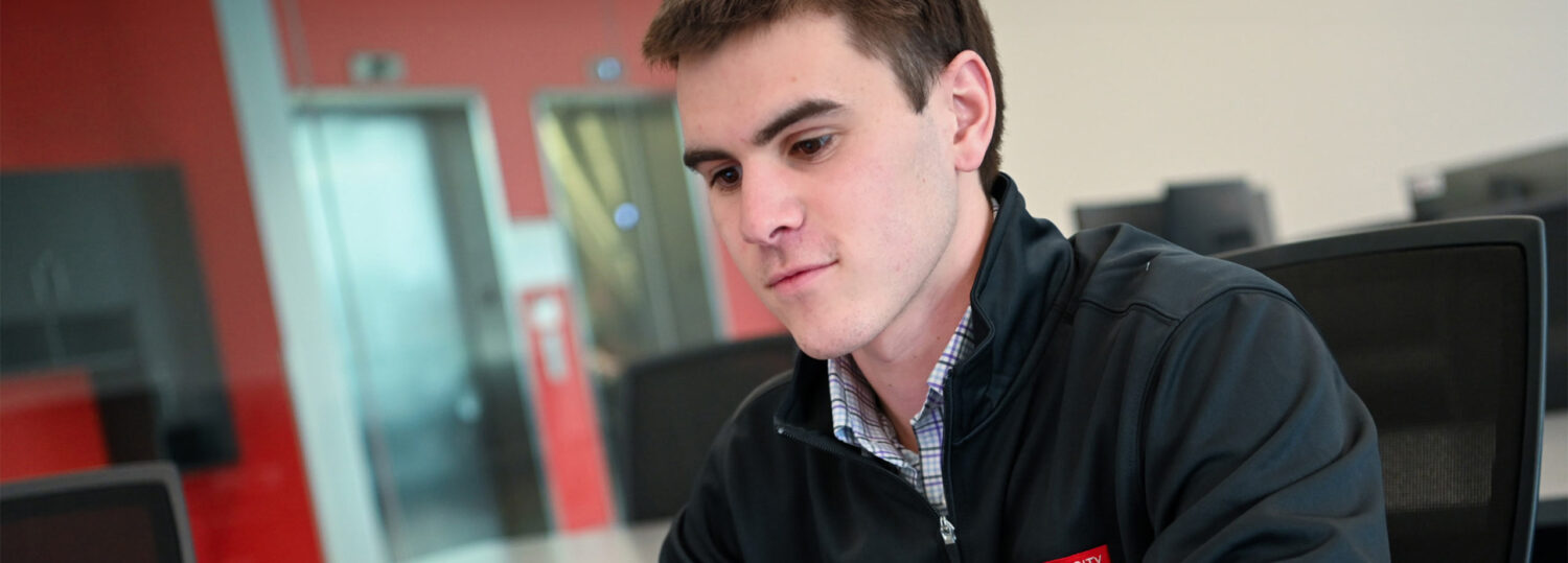 Paul Witmer, ABM Program's first student, studies in front of a computer.