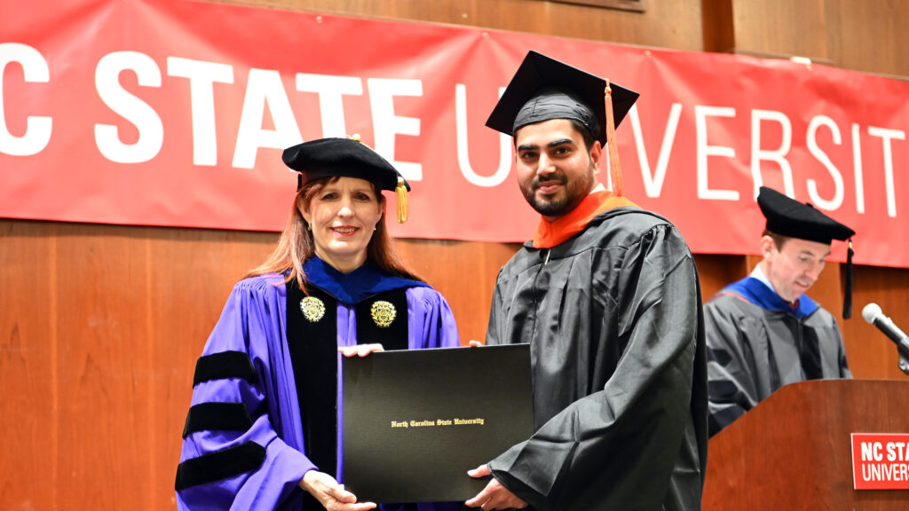 Mayuresh Chavan receives his degree from Julie Swann