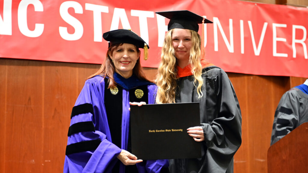 Anna Grocott poses with Julie Swann and her degree