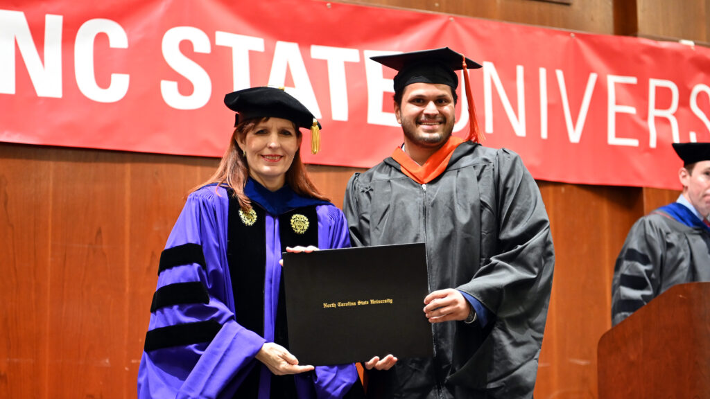 Rithvik Shashidhar receives his degree from Julie Swann