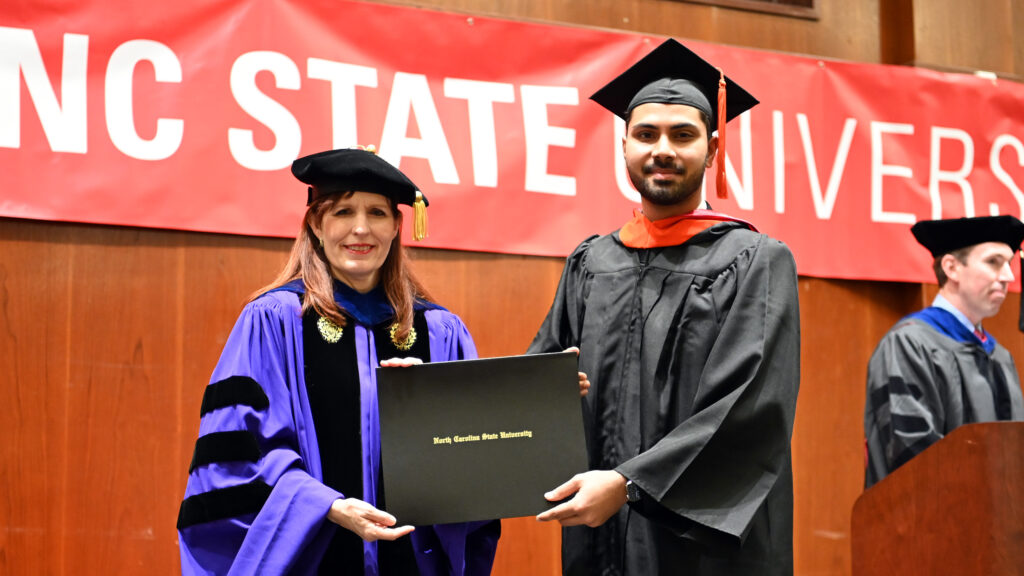 Anirudh Kulkarni receives his degree from Julie Swann