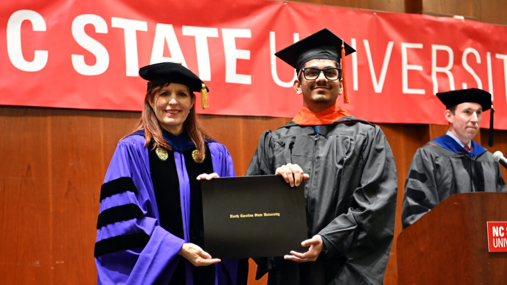 Bhargav Mahajan receives his degree from Julie Swann