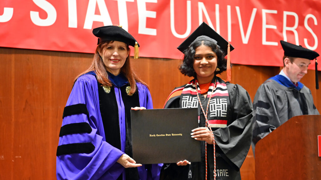 Shishari Puttaswamy receives her degree from Julie Swann