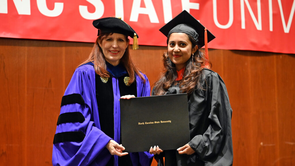 Sanjana Rao poses with Julie Swann and her degree