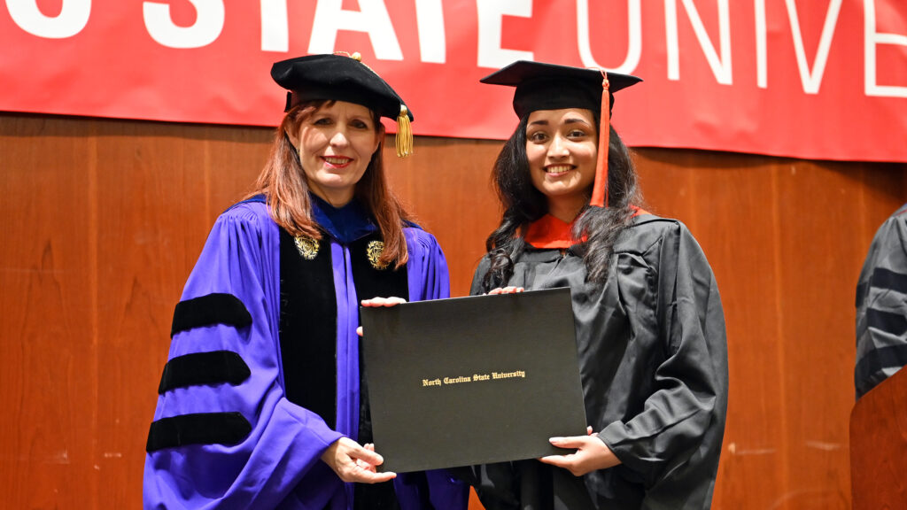 Hiral Shah receives her degree from Julie Swann