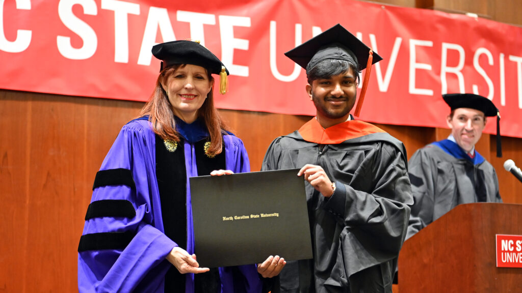 Viswak Subramanian receives his degree from Julie Swann