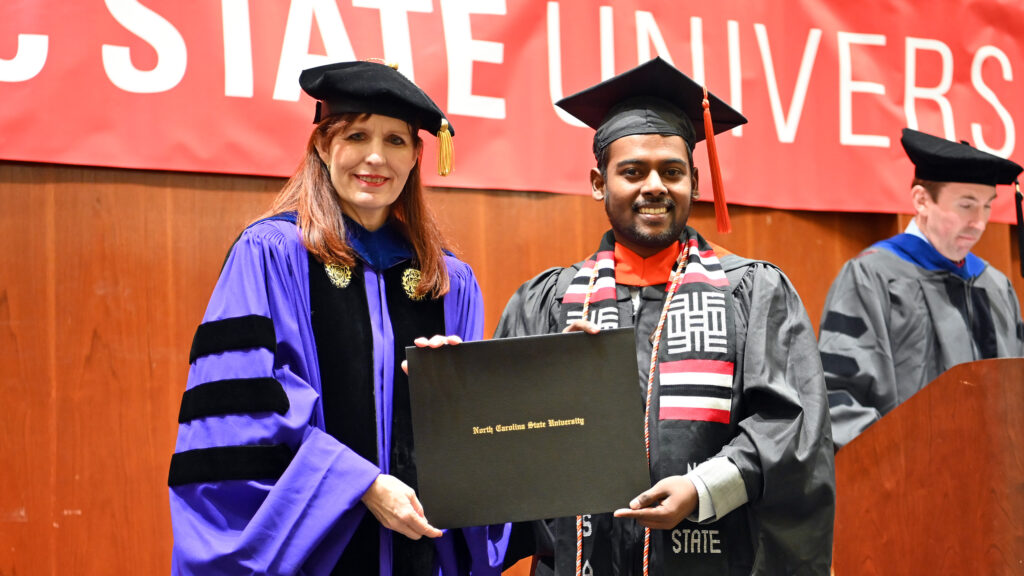 Lokeshana Sureshbabu Renukadevi poses with Julie Swann and his degree