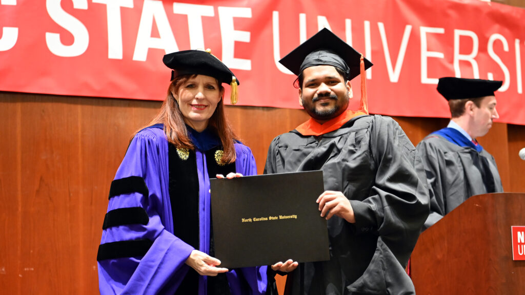 Kshitij Zarkar receives his degree from Julie Swann