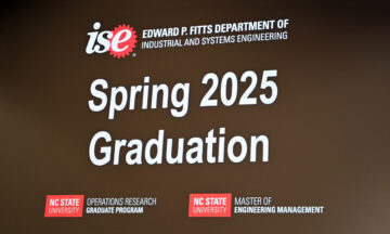 A welcome message to the MEM Spring 2025 Graduation Ceremony shown on a giant screen